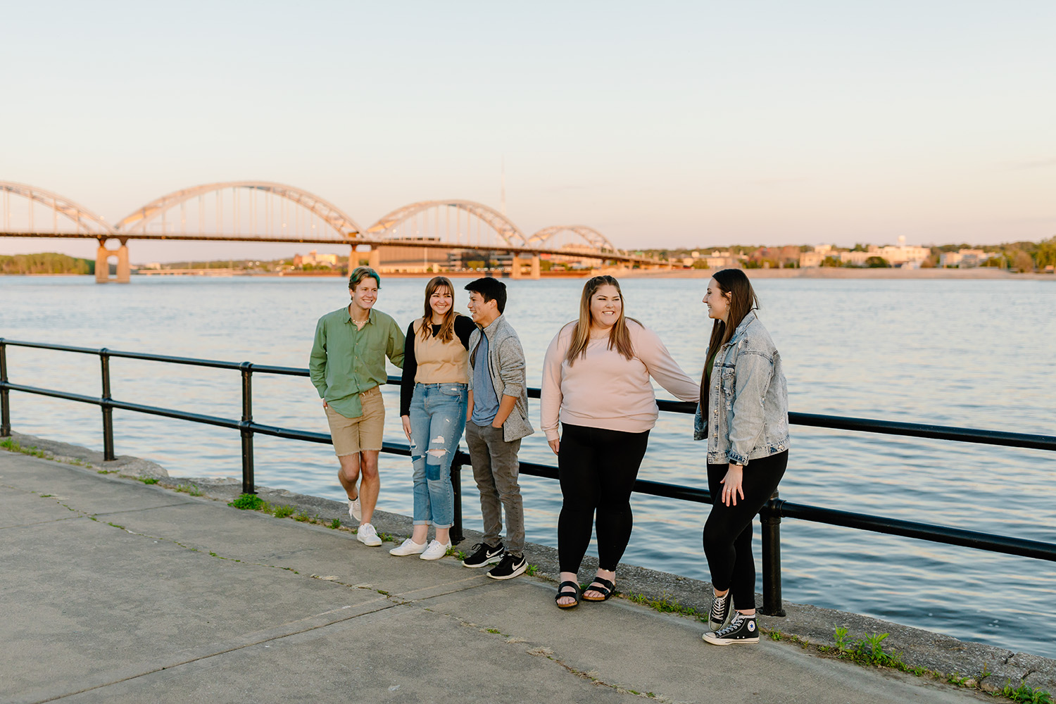 Students on the water front in front of the Centennial Bridge